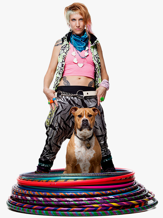 Donna Sparx standing in a stack of hula hoops with her dog