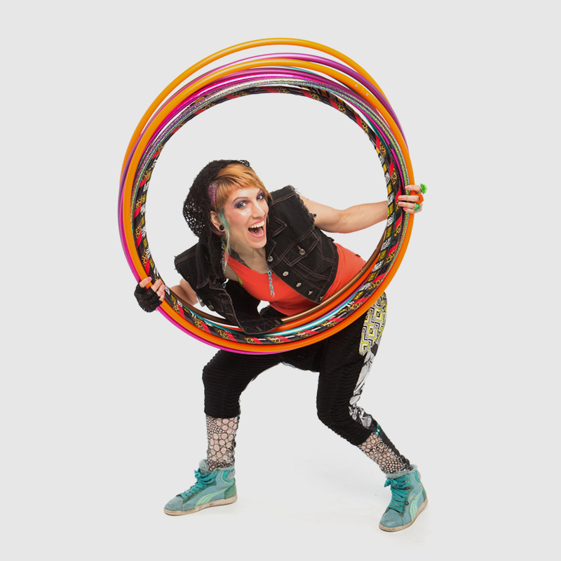 Donna Sparx peeking through her stack of hula hoops