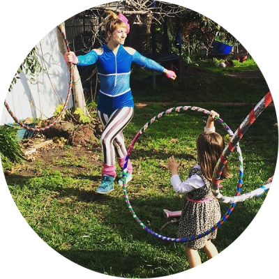 Donna Sparx teaching kids hoop dance at hula hoop birthday party